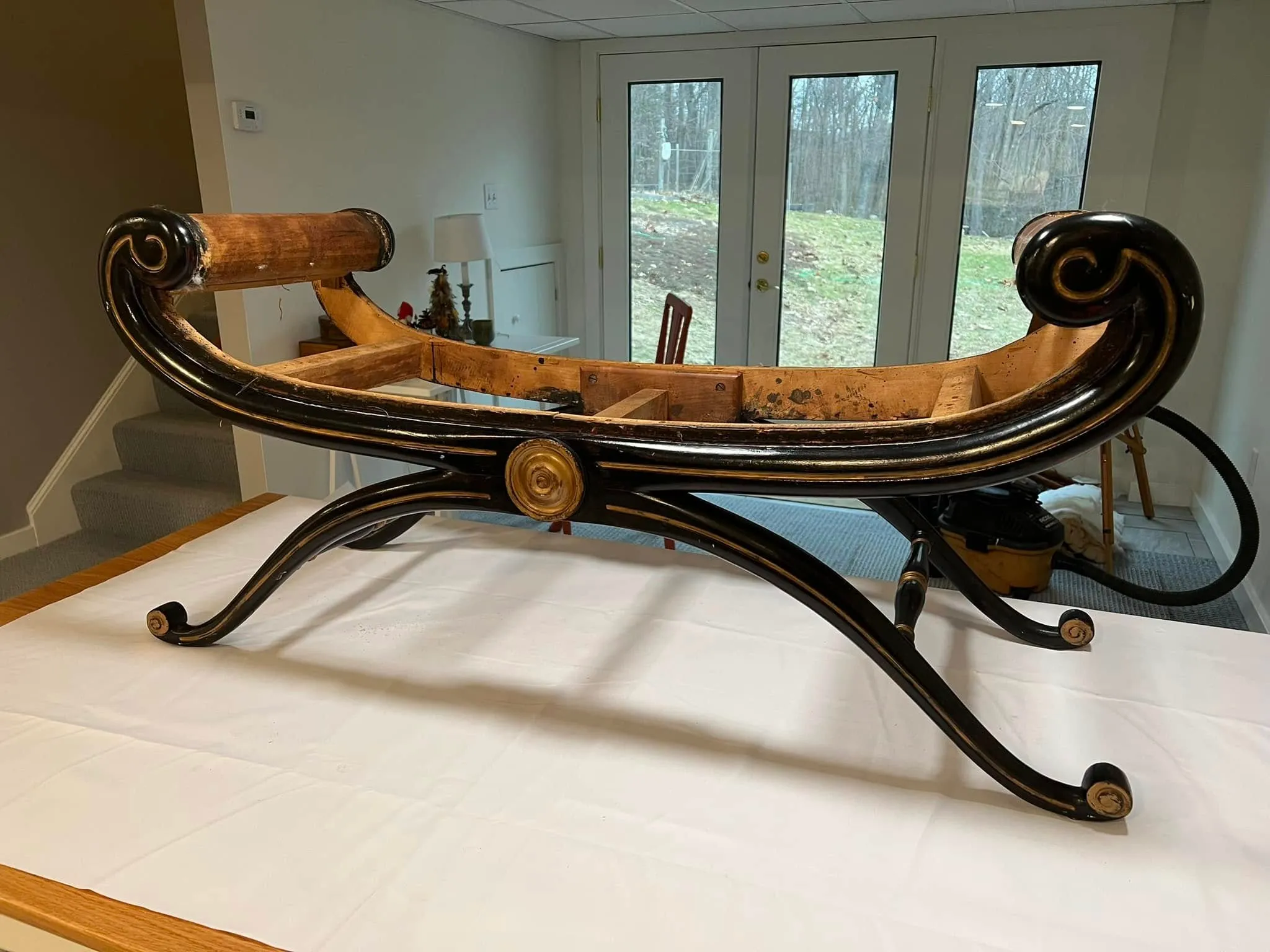 A scroll-arm bench